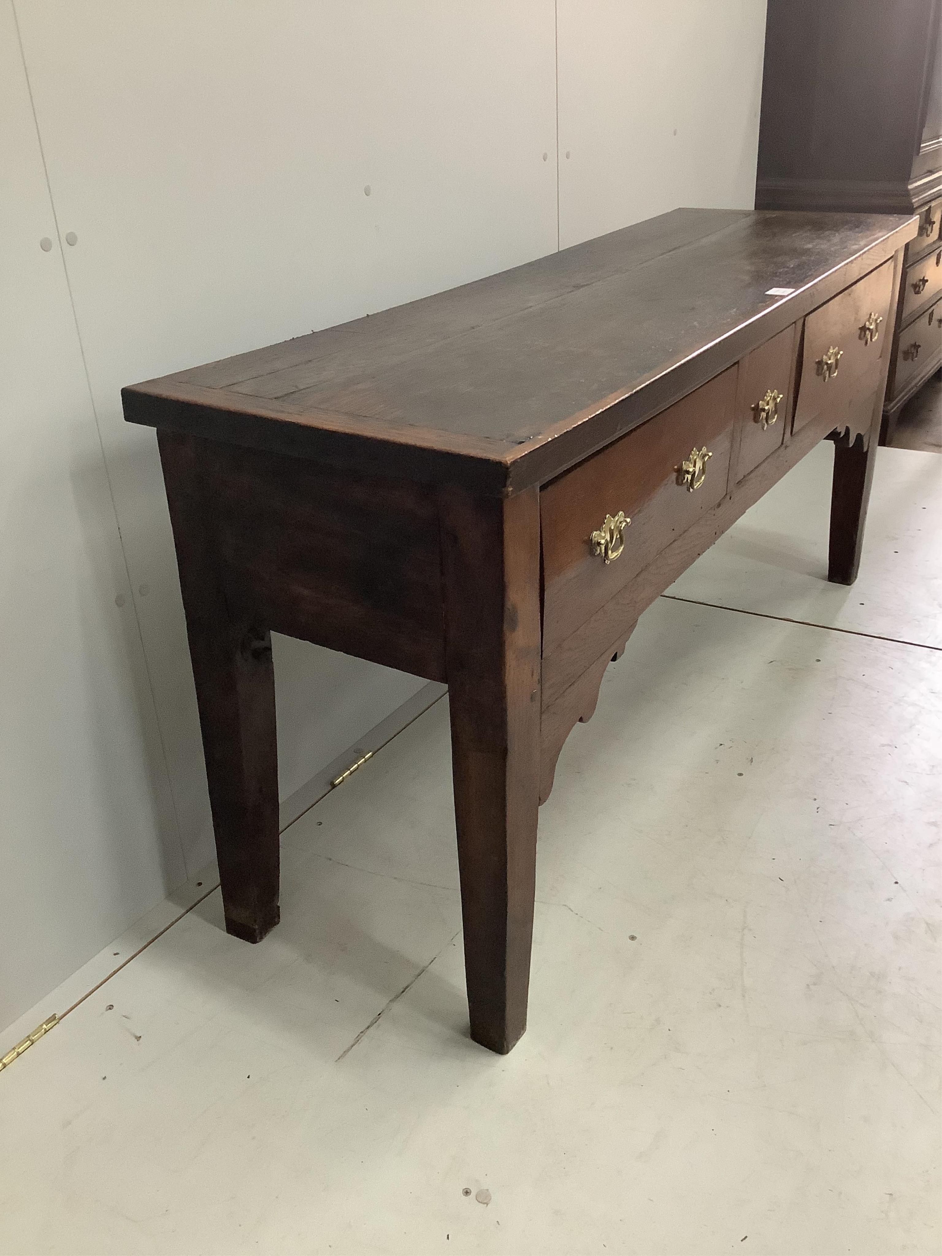 An 18th century style oak low dresser, width 157cm, depth 49cm, height 75cm. Condition - poor to fair